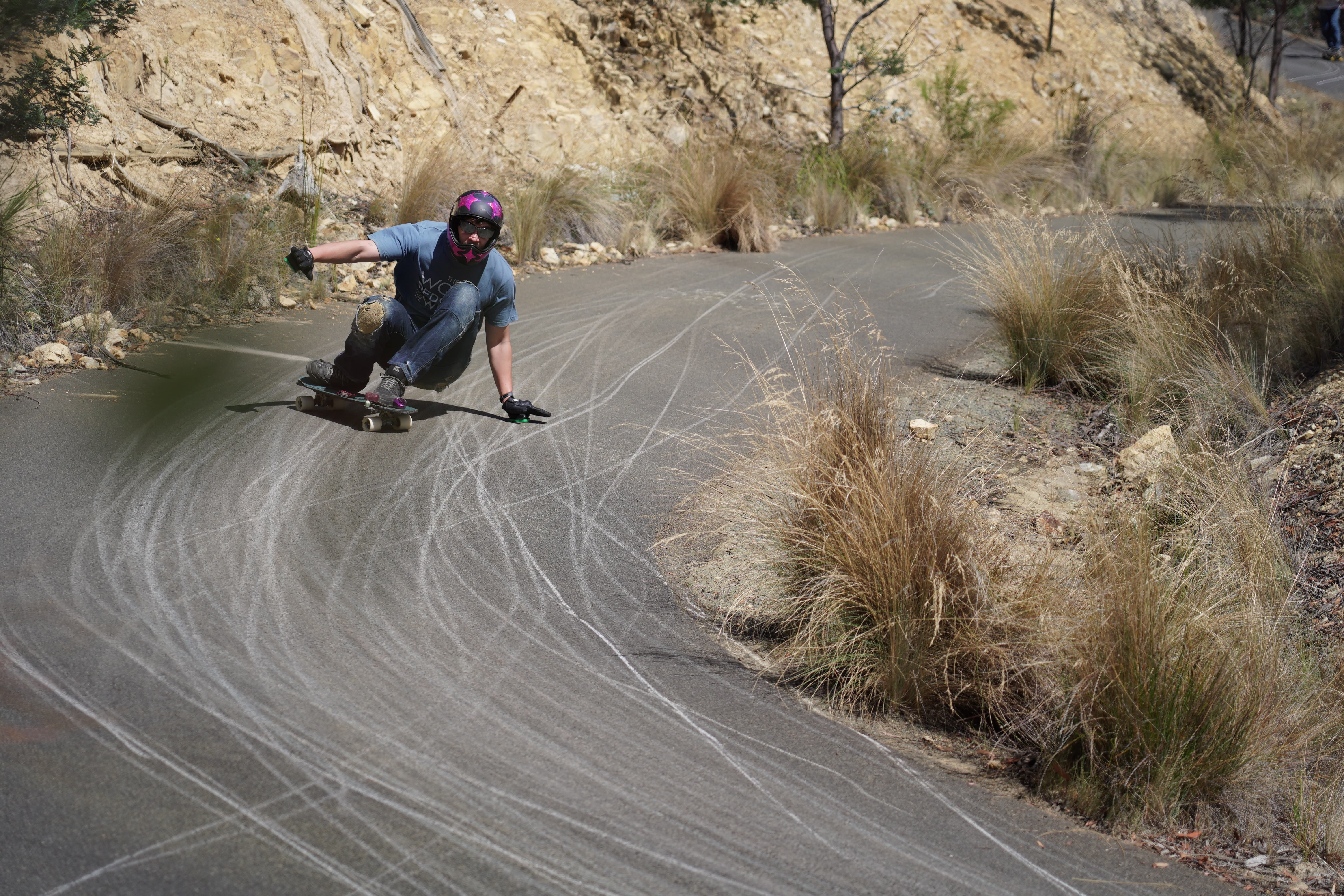 Caspian Baska leaning with a skateboard